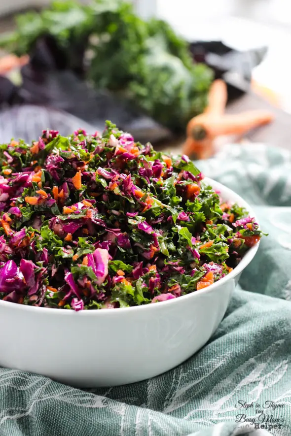 Hearty and healthy kale, cabbage and carrot slaw with a tangy vinaigrette. The perfect slaw for fall l Steph in Thyme for Busy Mom's Helper