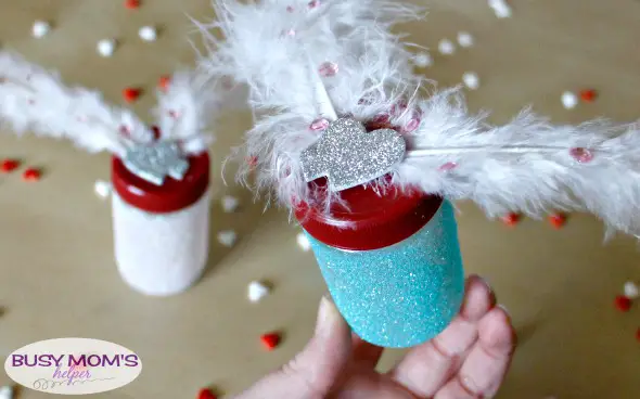 DIY Glitter Cupid Jars / a Valentine's Day craft by BusyMomsHelper.com / perfect party favor or gift idea