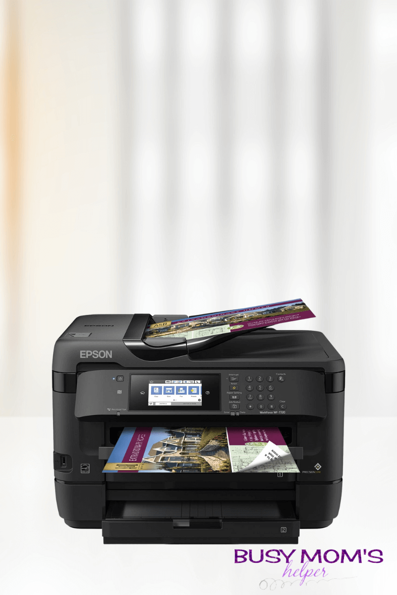 Photo of a black printer with blurred white background
